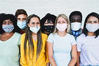 Photo of a group of young people wearing surgical masks 